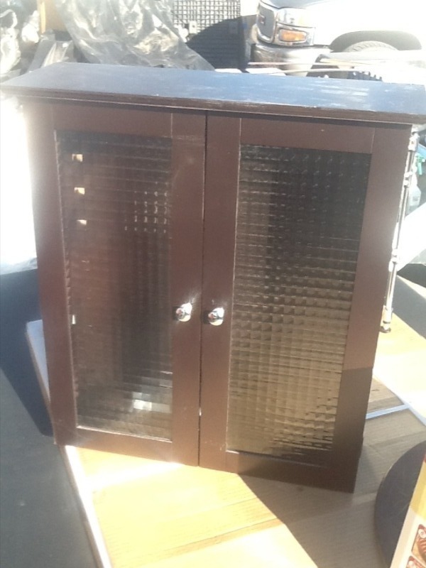 lot 9 image: Nice wall cabinet with two shelves and glass front one door glass is cracked