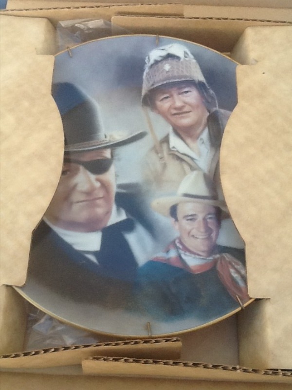 lot 56 image: John Wayne collector plate with wall mount bracket