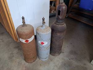 lot 4492 image: acetylene tanks - cap is stuck on one, possibly cross threaded