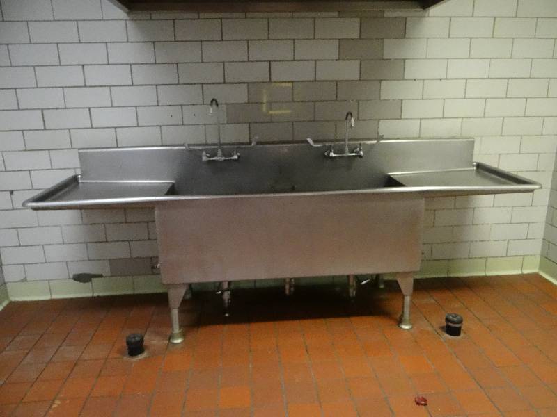 lot 1293 image: Large Stainless Steel 2 Bay Sink With Dual Faucets (Located In Kitchen)