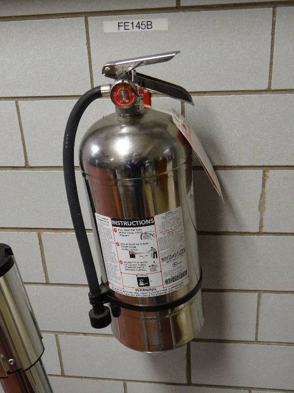 lot 1299 image: Class K Fire  Extinguisher (Located In Dining Area)