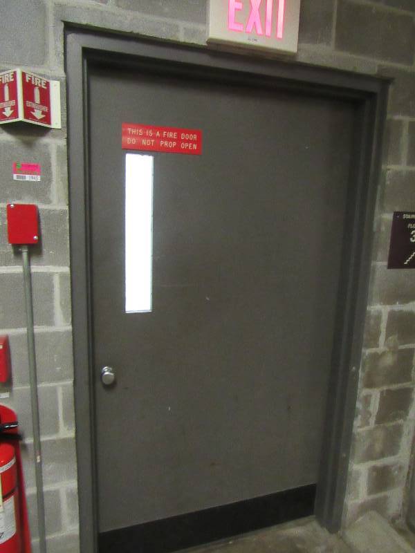 lot 1945 image: Fire Panel & Door & Utility Closet
