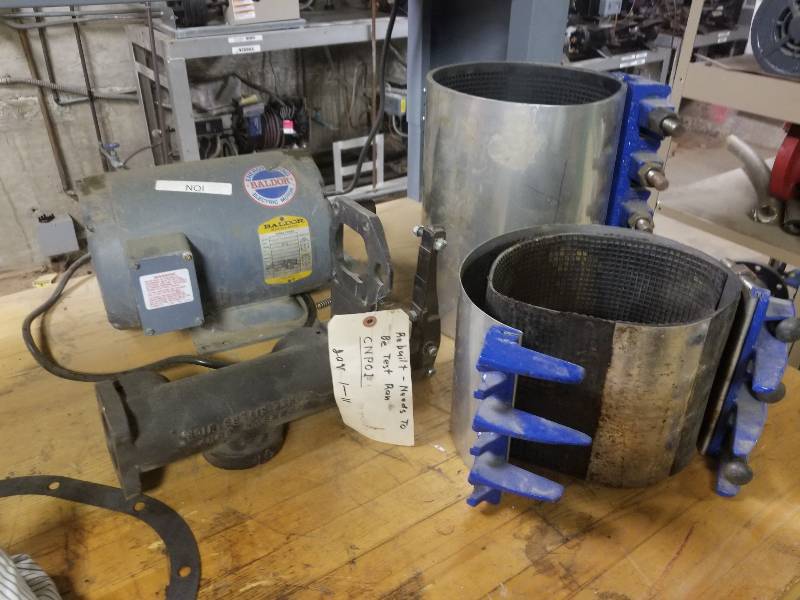 lot 1143 image: Baldor motor, 2 pipe clamps