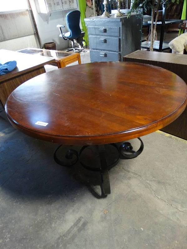 lot 118 image: 48 Round Wood Top table wIron Base.