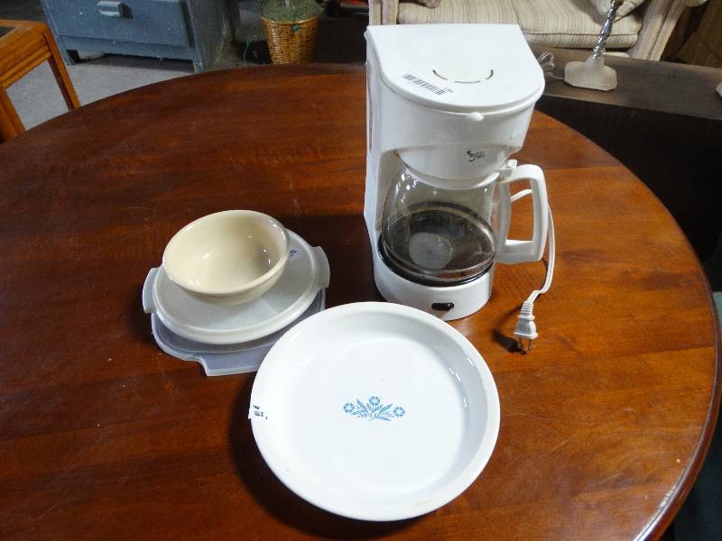 lot 196 image: Coffee Maker, Corningware Pie Dish, Plasticware.