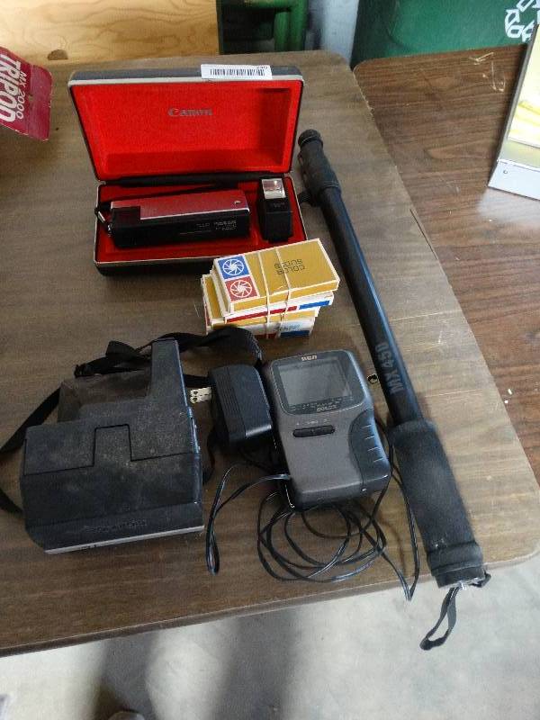 lot 240 image: Canon Camera wFlash, Color Slides, Polaroid Camera, RCA Color Mini TV, Camera Stand.
