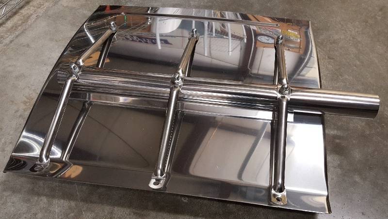 lot 5403 image: Single Big truck quarter stainless steel rear mud flap with swivel mounting bracket installed.  Im guessing the drives side