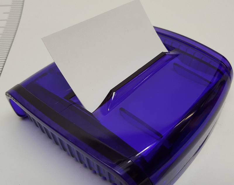 lot 5407 image: This is a new desk top note dispenser with heavy metal base to hold it in place and the 3 X 3 fan folded sheets have stick it on the back