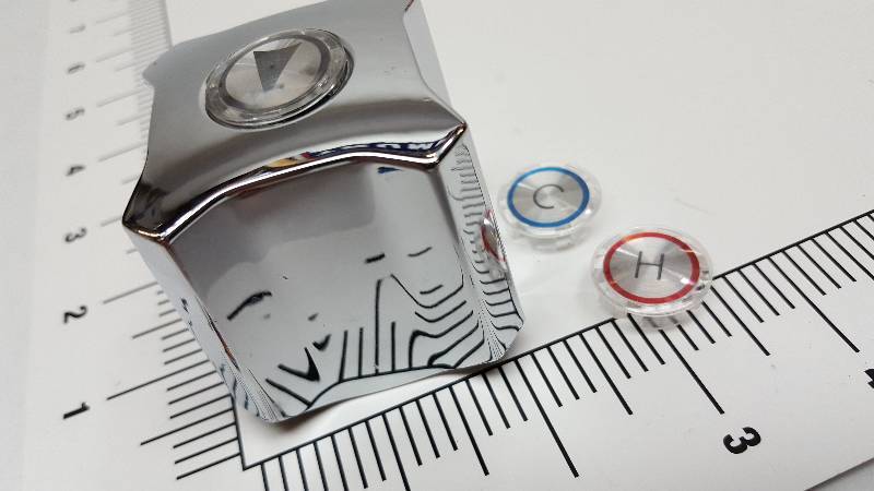 lot 5363 image: Its a new in the package water faucet knob with Hot Cold replacement buttons