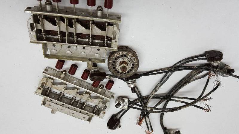 lot 5365 image: Found under the old Tinkerers work bench is this box of electronic pieces.  Look real close, I think I see something you might need later