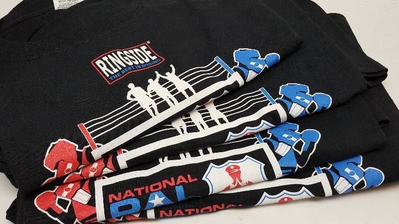 lot 5378 image: Stack of 4 new size Extra Large Fruit of the Loom Heavy HD Cotton promotional T Shirts from the National boxing tournament of 2015