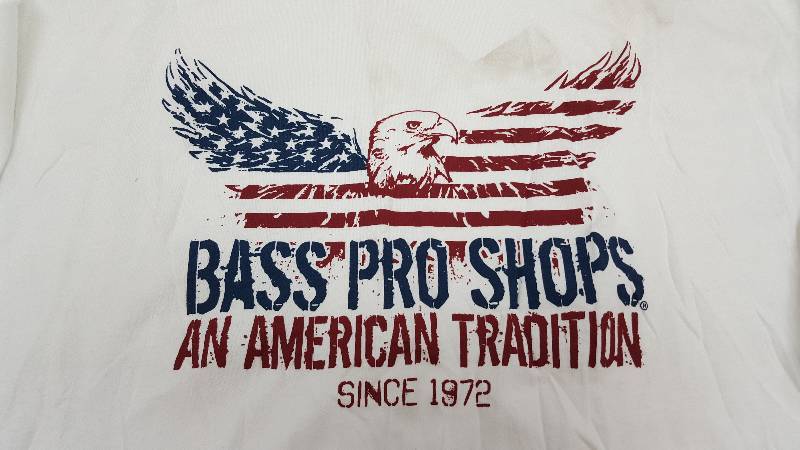 lot 5335 image: Its new but needs a wash job as its got some shelf dust on it.  If youre a big boy and do Bass Pro, this cool T shirts for you