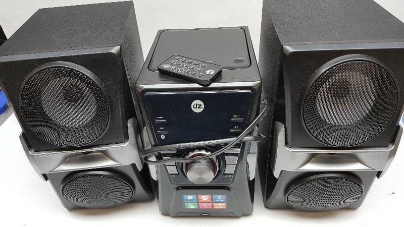 lot 5273 image: CD player and speaker system.  I cant get the player to power on so to be safe, Just place your bid for the speakers