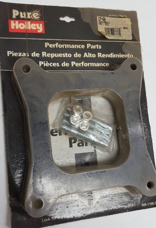 lot 5275 image: New old stock 1 thick made of the heat dissipating Phenolic open center Holley 4 barrel square bore carburetors