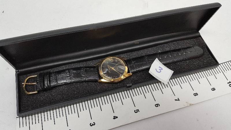 lot 5343-3 image: Cool looking and new in the plastic case is this colored costume watch