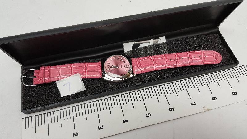 lot 5343-7 image: Cool looking and new in the plastic case is this colored costume watch