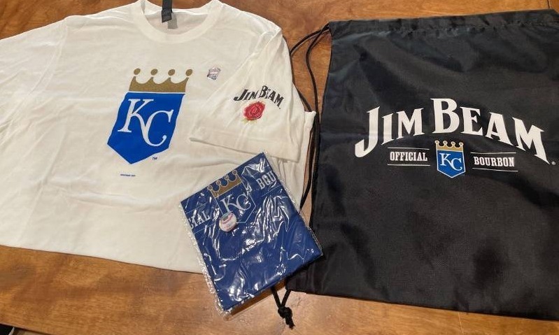 lot 39203 image: Kansas City Royals Official Sporting Wear Gift Package- One KC Royals T-Shirt - One Bandanna - One Black Draw String Bag All items Endorsement Jim Beam (Shirt Size Large)