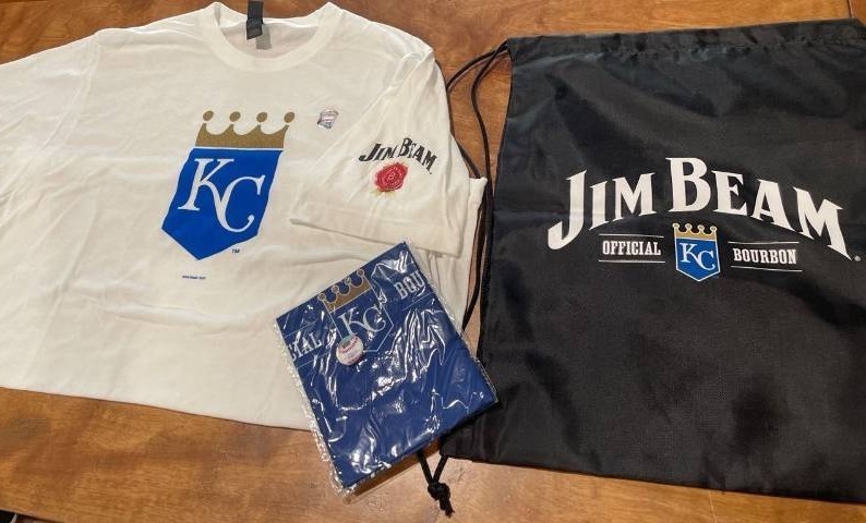 lot 39205 image: Kansas City Royals Official Sporting Wear Gift Package- One KC Royals T-Shirt - One Bandanna - One Black Draw String Bag All items Endorsement Jim Beam (Shirt Size MEDIUM )