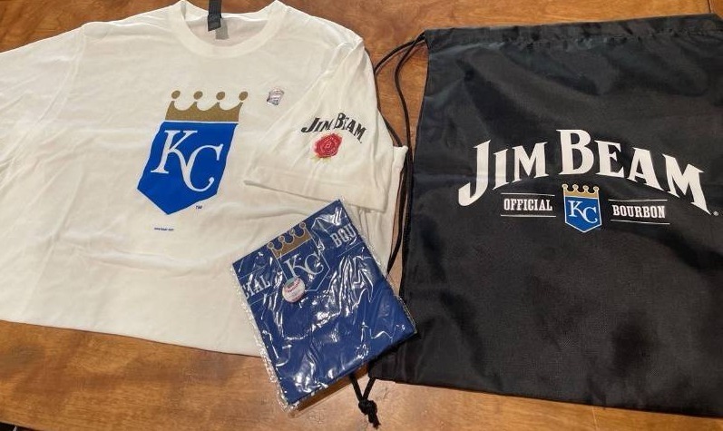 lot 39206 image: Kansas City Royals Official Sporting Wear Gift Package- One KC Royals T-Shirt - One Bandanna - One Black Draw String Bag All items Endorsement Jim Beam (Shirt Size MEDIUM )