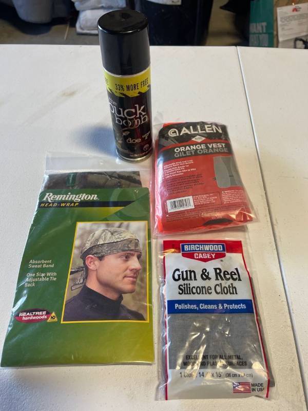 lot 32665 image: Hunters Value Pack - Remington Head Wrap Orange Vest Gun & Reel Silicon Cloth And The Buck Bomb doe P