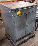 Serious HD service writers all metal cabinet desk with top drawer and swinging doors on the front with shelf inside.