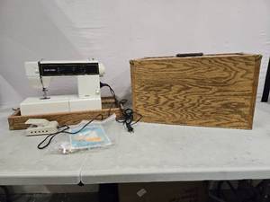 lot 2035 image: Vintage So Fro sewing machine model 9102 with Wooden storage case