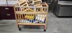 lot 12385 image: Child Crib with Contents