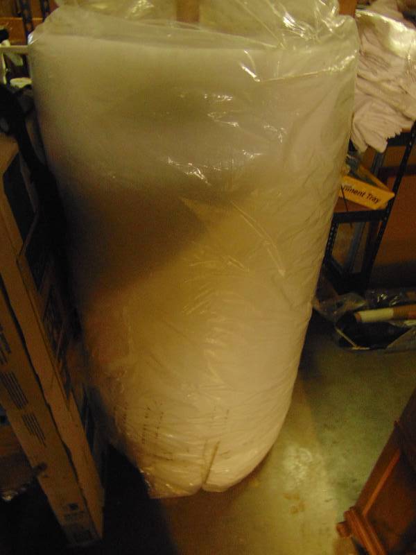lot 1073 image: (1) roll cotton batting for upholstery, 55 W x 1 thick x approx 50 yards (32 diameter roll)