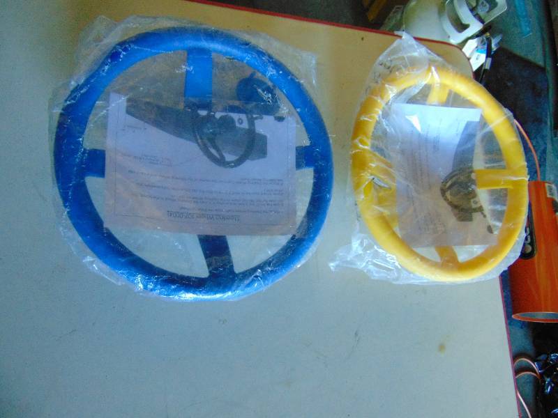 lot 1128 image: (2) ct. lot plastic play set steering wheels, yellow and blue