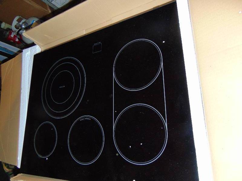 lot 1172 image: Stove top Induction glass, 31 x 23-34, 5 burner- glass cover only, does not include cook top