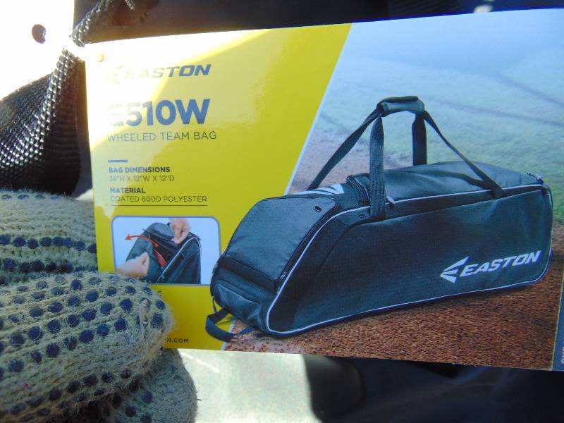 lot 1232 image: Easton Rolling Sports Bag, used, damage to bottom, small tear