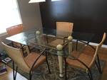 Glass top beveled dining table with 4 wicker chairs