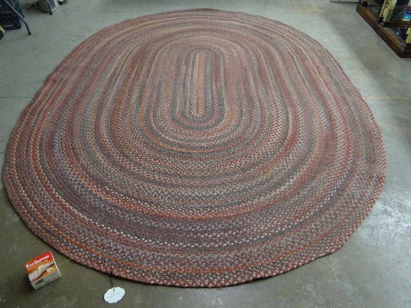 lot 824 image: 8 x 11 oval braided area rug w new rug gripper
