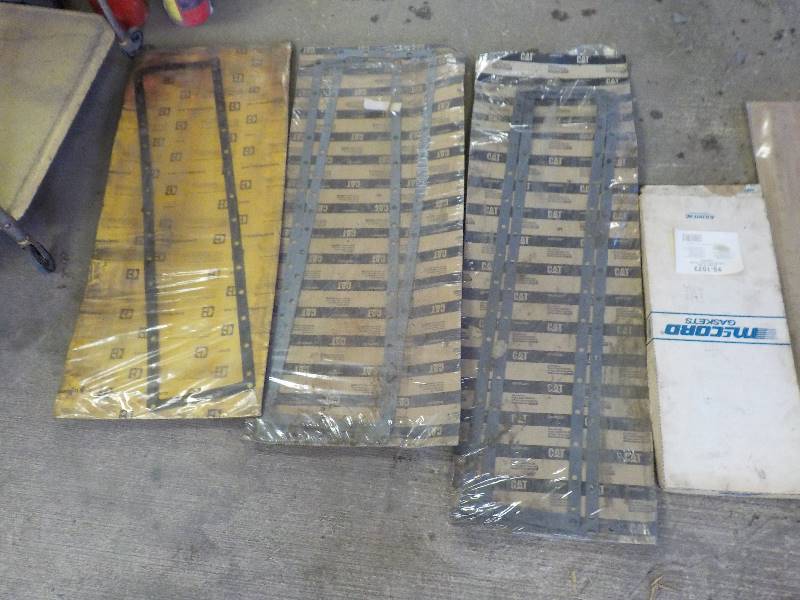 lot 3592 image: 4 gaskets 3 CAT radiator and one chrysler 360 engine gaskets