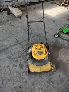 lot 1079 image: Yard Man push mower has compression