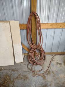 lot 1098 image: hoses hanging on the wall
