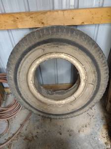 lot 1099 image: 10-20 tractor tire and wheel tires no good still holding air