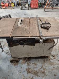 lot 1142 image: table saw on roller