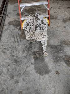 lot 1320 image: cast iron chair needs leg put back on