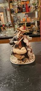 lot 2046 image: 8 inch tall statue man playing fiddle.