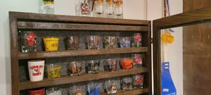 lot 2092 image: Collectible shot glasses Cabinet include it Top 2 rows
