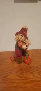 lot 2223 image: Scarecrow riding tricycle,