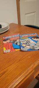 lot 2277 image: Two Smallville comic books