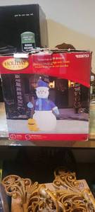 lot 2314 image: Holiday living seven foot snowman with broom , blow up untested