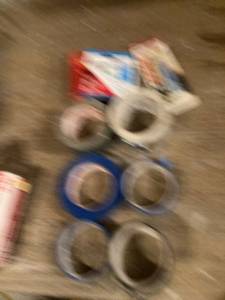 lot 3244 image: Rolls of tape, staples, and contact cement