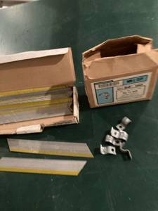 lot 3299 image: 17 nail strips and half a box of clips