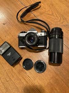 lot 3364 image: Canon camera with extra camera items