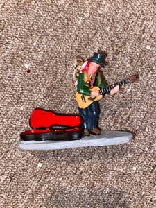 lot 4024 image: little man play instrument