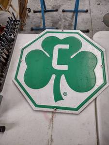 lot 1228 image: 20-in octagon sign with a cloverleaf and the letter c