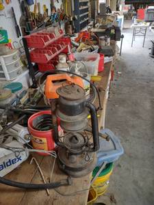 lot 1266 image: everything from the floor to the top of the bench does not include grinder vice or John Deere mower blades top of the bench down